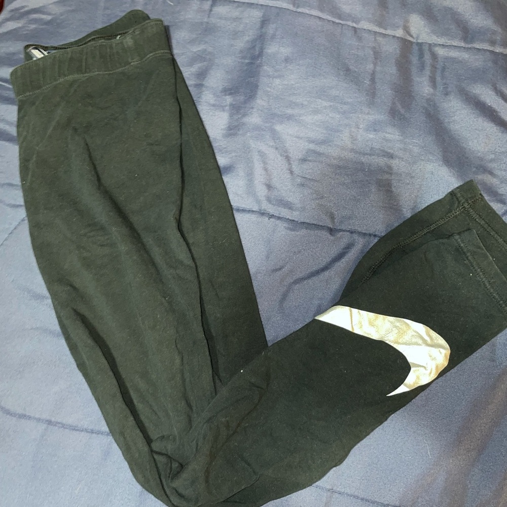 Nike metallic swoosh black leggings size S women’s
